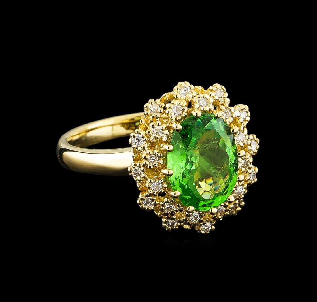 2.88 ctw Tsavorite and Diamond Ring - 14KT Yellow Gold: One Ring featuring: 14KT Yellow Gold weighing 5.43 grams containing one Tsavorite center stone with a total weight of 2.88ct and Diamonds with a total weight of 0.24ct.
