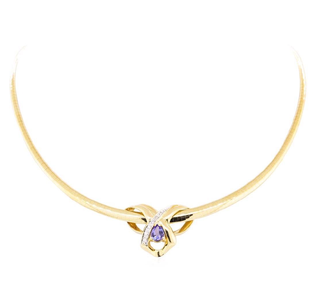 1.40 ctw Tanzanite And Diamond Pendant And Chain - 14KT: One electronically tested 14KT yellow gold lady's combination cast & assembled fashion pendant and chain 18.0' long, tapered domed omega chain with a tongue clasp with foldover safety with a bright po