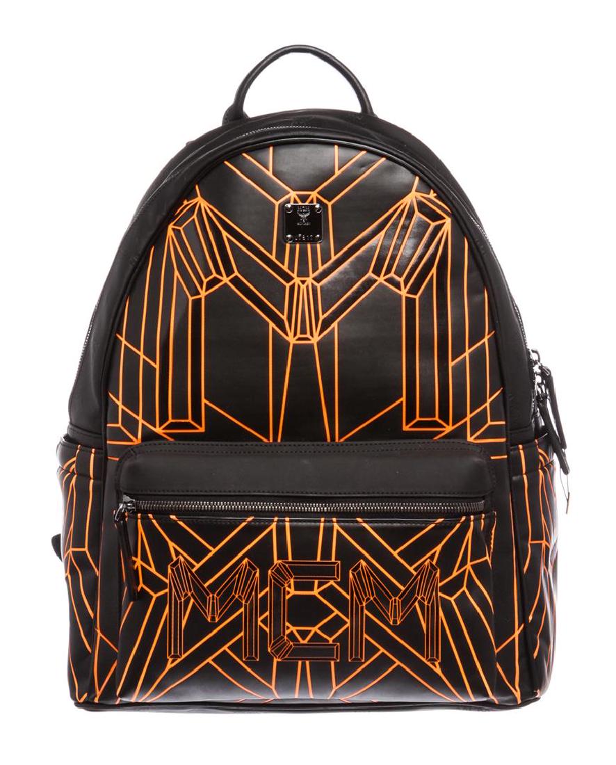 MCM Black Orange Visetos Bionic Backpack: Black and orange embossed Visetos coated canvas MCM Bionic backpack with gunmetal hardware, dual adjustable shoulder straps, single flat handle at top, logo placard and zip pocket at front face, dual