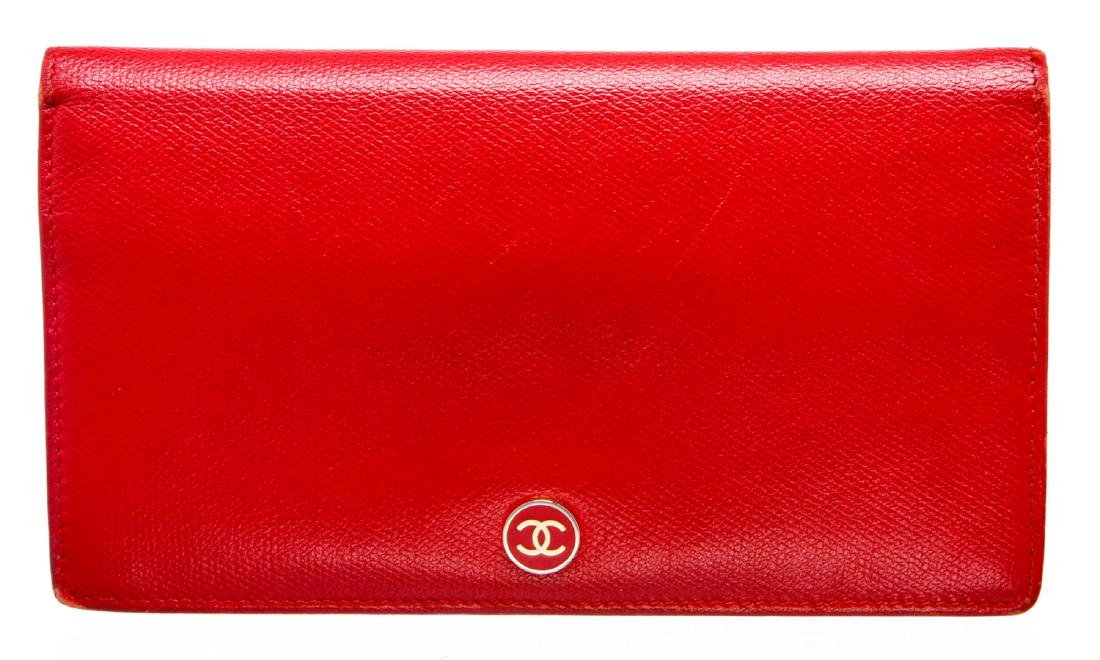 Chanel Red Leather CC Long Wallet: Chanel red leather CC long wallet with gold-tone hardware, interior zipper compartment, bill pockets, and eight card slots, flap bifold closure.