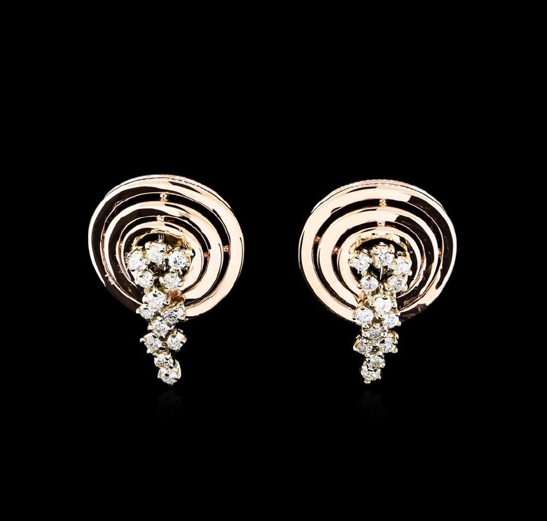 0.88 ctw Diamond Earrings - 14KT Two-Tone Gold: One pair electronically tested 14KT rose and white gold lady's combination cast & assembled fashion earrings with Omega clip backs with posts with a bright polish finish. Identified with markings of "