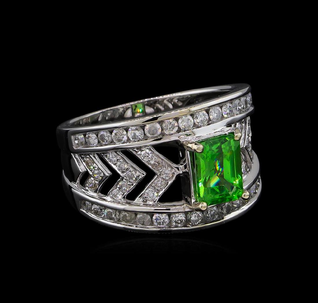 1.31 ctw Tsavorite and Diamond Ring - 14KT White Gold: One electronically tested 14KT white gold lady's cast fashion ring with a three row wide band with a bright polish finish. The featured lady's ring has a shank measuring 4.91 millimeters wide. Tradema