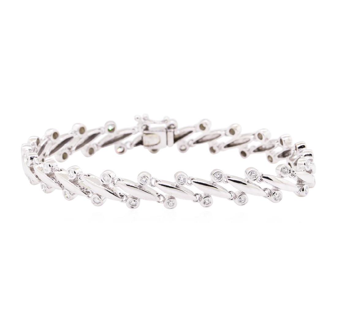 1.15 ctw Diamond Tennis Bracelet - 14KT White Gold: One electronically tested 14KT white gold lady's combination cast & assembled fashion tennis bracelet with a tongue clasp with foldover safety with a bright polish finish. The featured lady's bracelet