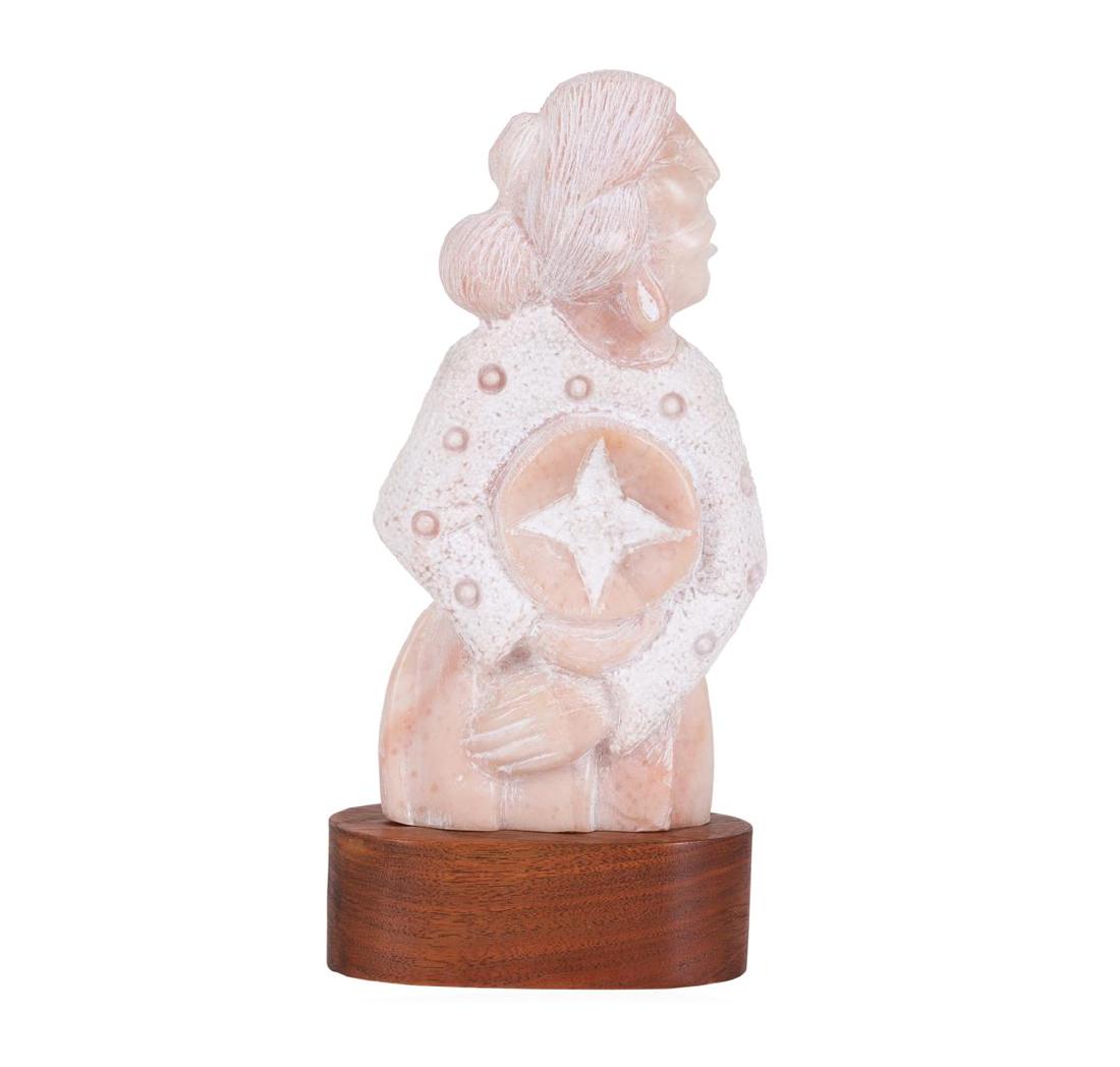 Native American Artist Robert Morning Gun Carved Stone: One sculpture of a Native American woman, carved from marble and presented on a freeform base. The sculpture is signed R. Morning Gun and dated '91. The statue has no visible defects and measures elev