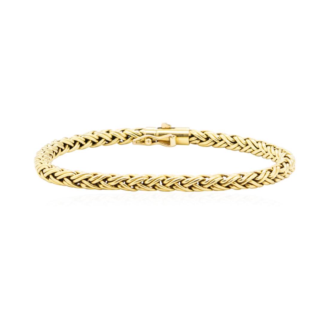 Tiffany and Company Golden Weave Wheat Chain Bracelet -: One Tiffany and Company golden weave wheat chain bracelet featuring: 18KT yellow gold weighing 12.5 grams. The bracelet measures approximately seven inches in length.