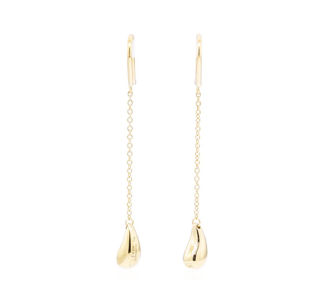 Tiffany and Company Elsa Peretti Teardrop Dangle: One pair of Tiffany and Company Elsa Peretti teardop earrings featuring: 18KT yellow gold weighing 4.1 grams. The earrings have french wire posts and a drop of approximately 49 millimeters.