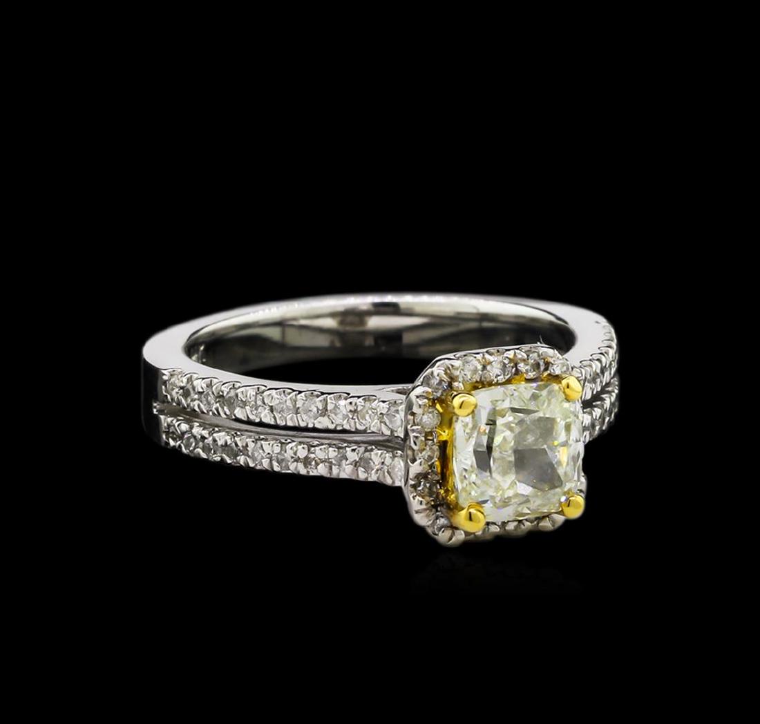 1.38 ctw Fancy Yellow Diamond Ring - 14KT Two-Tone Gold: One electronically tested 14KT white and yellow gold lady's combination cast & assembled wedding ring with a split shank halo with a bright polish finish. The featured lady's ring has a shank measurin