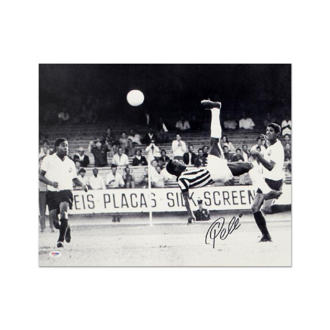 Scissor Kick (black & white) by Pele: "Scissor Kick" is a print on paper that is autographed by legendary Brazilian footballer, Pele. This piece is presented with a Certificate of Authenticity from PSA/DNA, which authenticates sports memo