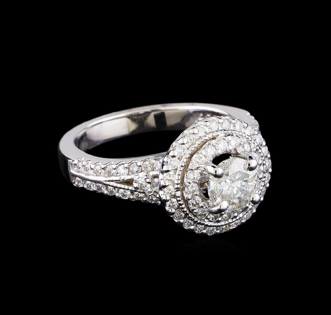 1.33 ctw Diamond Ring - 14KT White Gold: One electronically tested 14KT white gold lady's cast wedding ring with a double halo with a bright polish finish. The featured lady's ring has a shank measuring 2.58 millimeters in width. Identified 