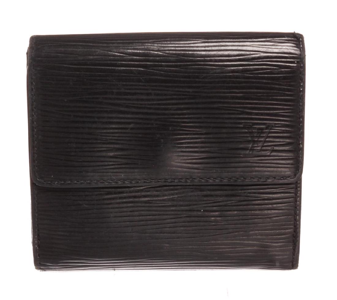 Louis Vuitton Black Epi Leather Elise Wallet: Black Epi leather Louis Vuitton Elise wallet with brass hardware, single exterior pocket with snap closure at flap, debossed logo at front corner, tonal leather interior, single bill compartment, six