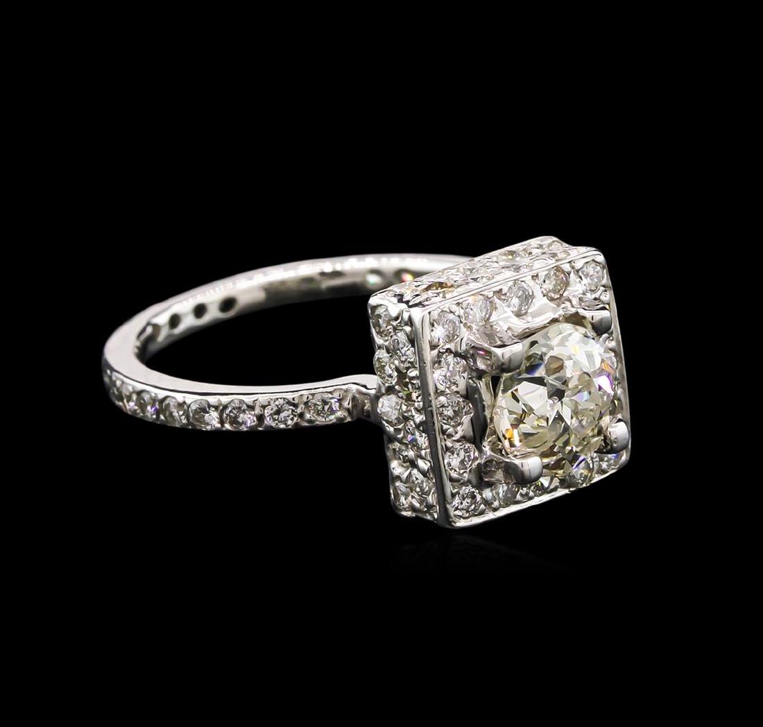 1.80 ctw Diamond Ring - 14KT White Gold: One electronically tested 14KT white gold lady's cast wedding ring with a halo with a bright polish finish. The featured lady's ring has a shank measuring 1.65 millimeters wide. Identified with markin