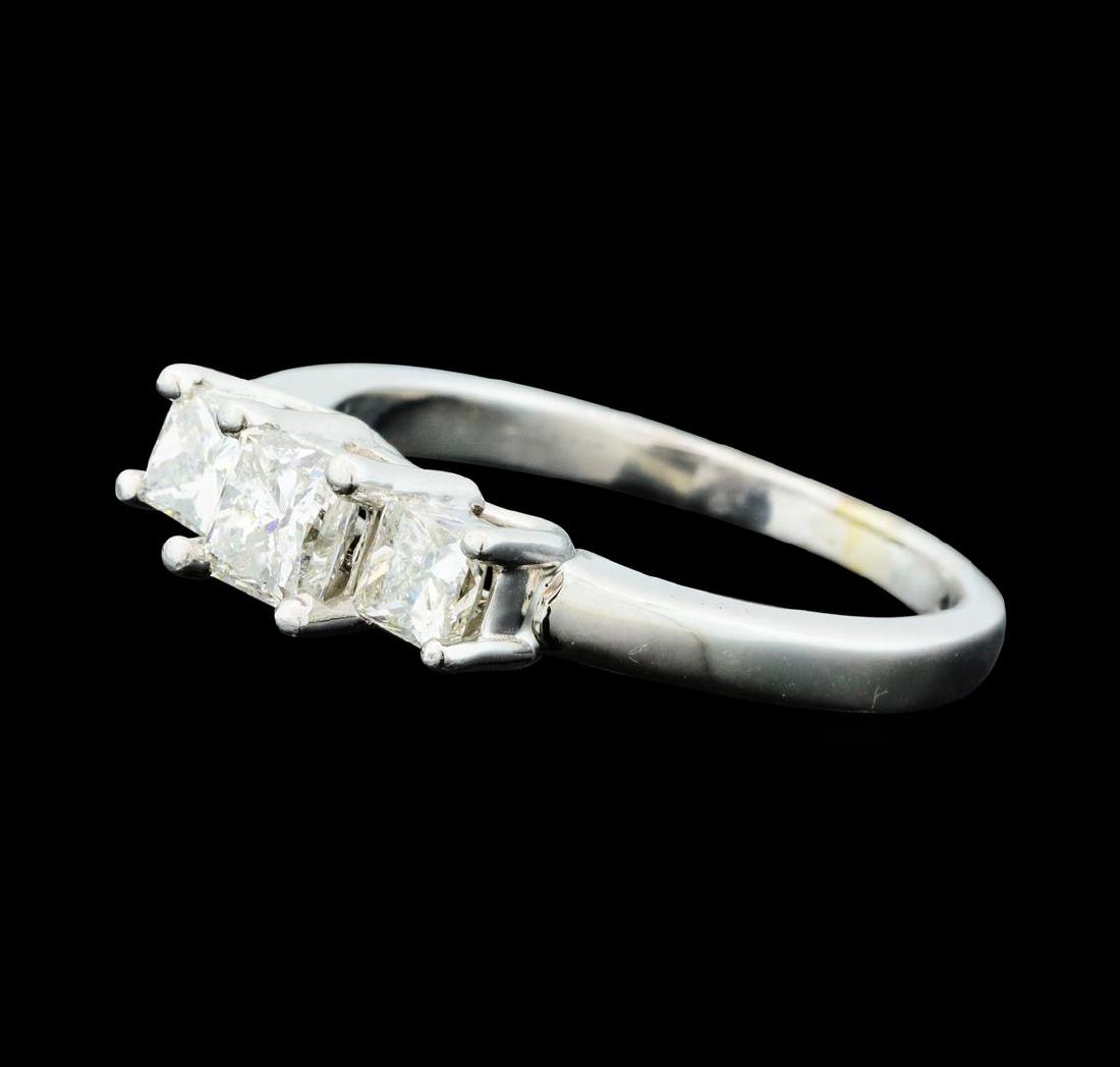 1.00 ctw Diamond Ring - Platinum: One electronically tested platinum lady's cast 3-stone wedding ring with a straight line with a bright polish finish. The featured lady's ring has a shank measuring 1.92 millimeters wide. Identified w