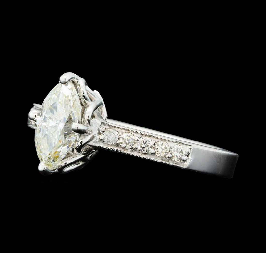 1.21 ctw Diamond Ring - 14KT White Gold: One electronically tested 14KT white gold lady's cast wedding ring with a cathedral shank with a bright polish with milgrain detailing finish. The featured lady's ring has a shank measuring 2.61 milli