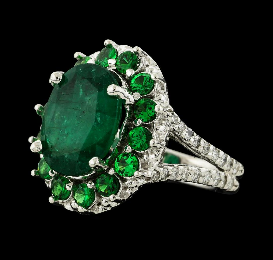 4.54 ctw Emerald, Tsavorite and Diamond Ring - 14KT: One electronically tested 14KT white gold lady's cast fashion ring with a split shank basket halo with a bright polish finish. The featured lady's ring has a double shank measuring 3.34 millimeters wi