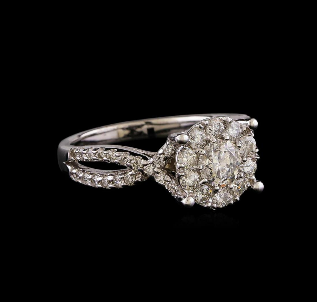 1.35 ctw Diamond Ring - 14KT White Gold: One electronically tested 14KT white gold lady's cast wedding ring with a crossover shank basket halo with a bright polish finish. The featured lady's ring has a shank measuring 2.18 millimeters wide.