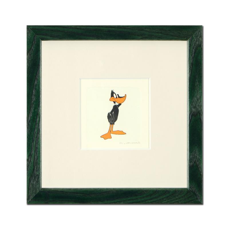 Daffy Duck (Looking to the Side) by Looney Tunes: "Daffy Duck (Looking to the Side)" is a limited edition etching on paper with hand-tinted coloring from Warner Bros, numbered and dated 1999. This piece comes framed. Measures approx. 9" x 9" (with fr