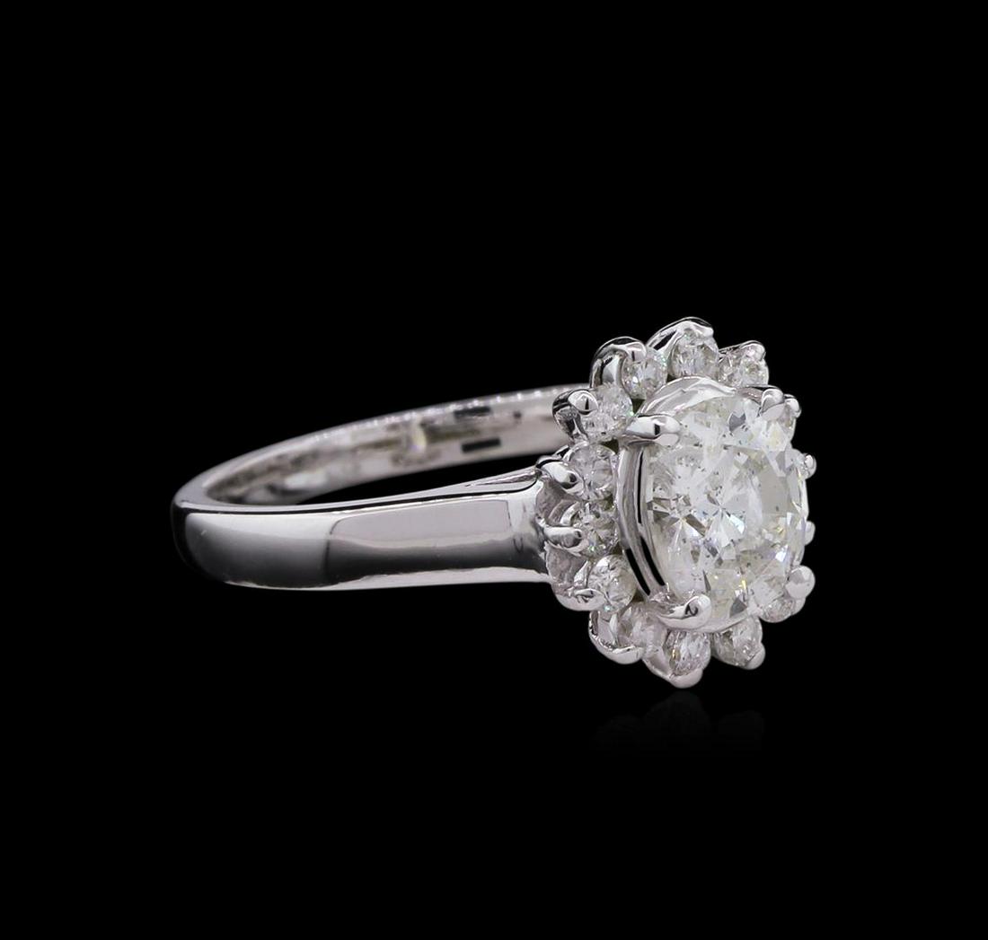 1.31 ctw Diamond Ring - 14KT White Gold: One electronically tested 14KT white gold lady's cast wedding ring with a basket halo with a bright polish finish. The featured lady's ring has a shank measuring 2.13 millimeters wide. Identified with