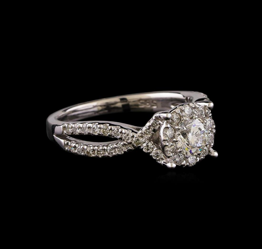 1.05 ctw Diamond Ring - 14KT White Gold: One electronically tested 14KT white gold lady's cast wedding ring with a split shank halo with a bright polish finish. The featured lady's ring has a shank measuring 2.08 millimeters wide. Identified