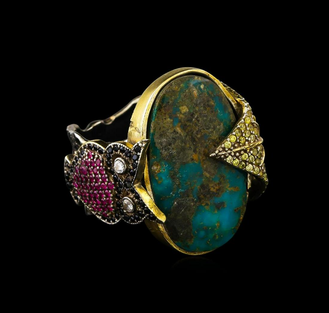 Sterling Silver Ring: One of a kind high fashion sterling silver Ring weighing 25.5 grams. Black Antique texture. Containing: Turquoise, Synthetic Ruby, White Crystal, Black Crystal, Yellow Crystal. This sterling silver pr