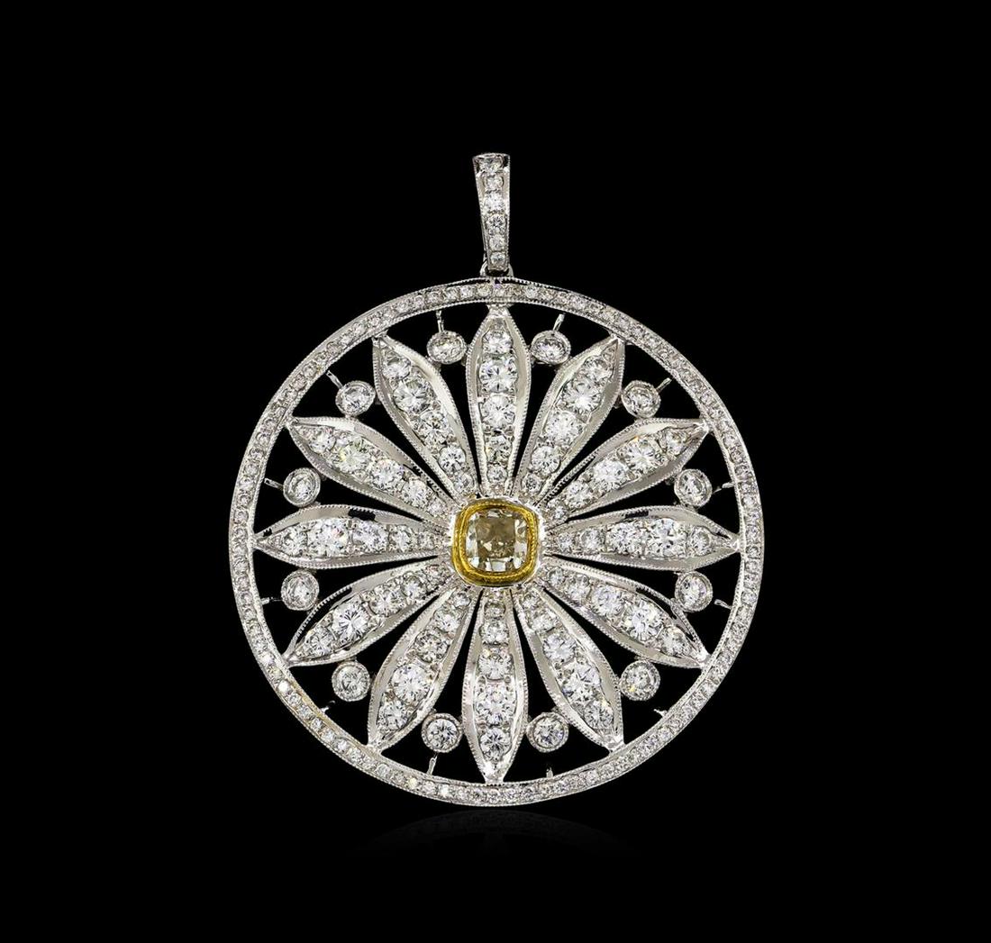 4.59 ctw Diamond Pendant - 18KT White Gold: One electronically tested 18KT white gold ladies cast & assembled diamond pendant. The featured diamond is set within a diamond daisy encompassed by a forty millimeter wide diamond bezel disc, complet