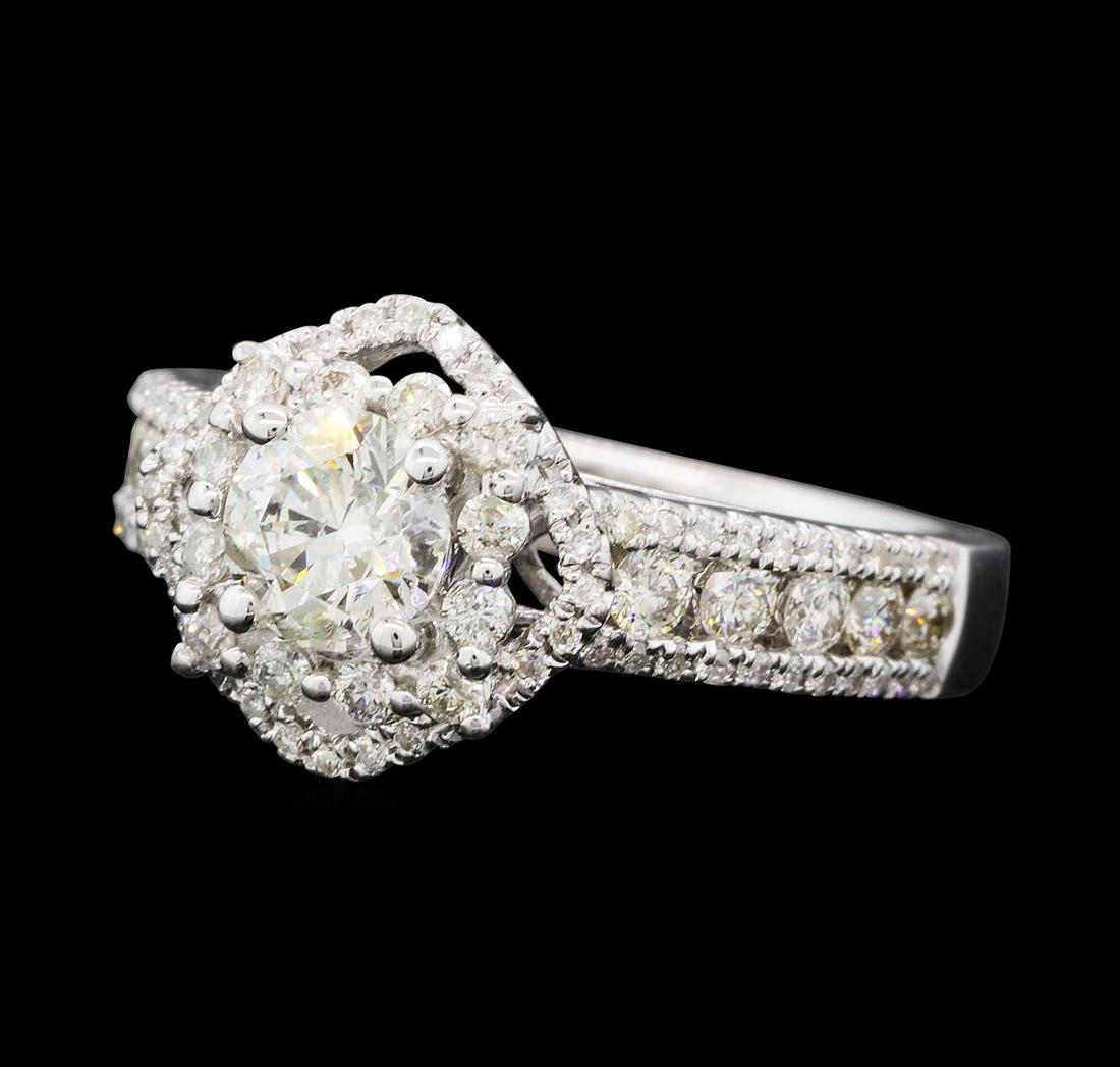 1.40 ctw Diamond Ring - 14KT White Gold: One electronically tested 14KT white gold lady's cast wedding ring with a cathedral shank with a halo with a bright polish finish. The featured lady's ring has a shank measuring 3.00 millimeters wide.