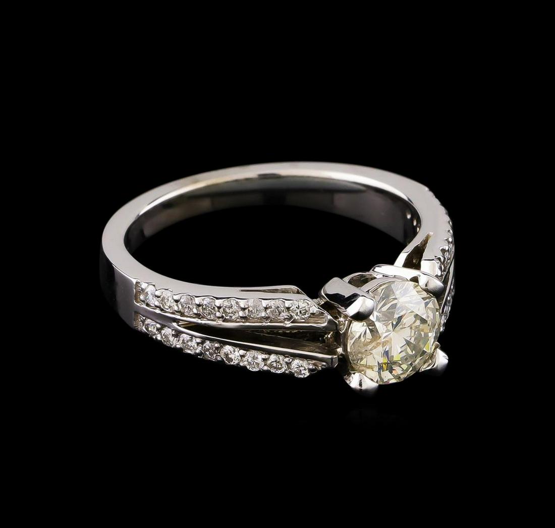 1.34 ctw Diamond Ring - 14KT White Gold: One electronically tested 14KT white gold lady's cast wedding ring with a split shank with a bright polish finish. The featured lady's ring has a shank measuring 2.26 millimeters wide. Identified with