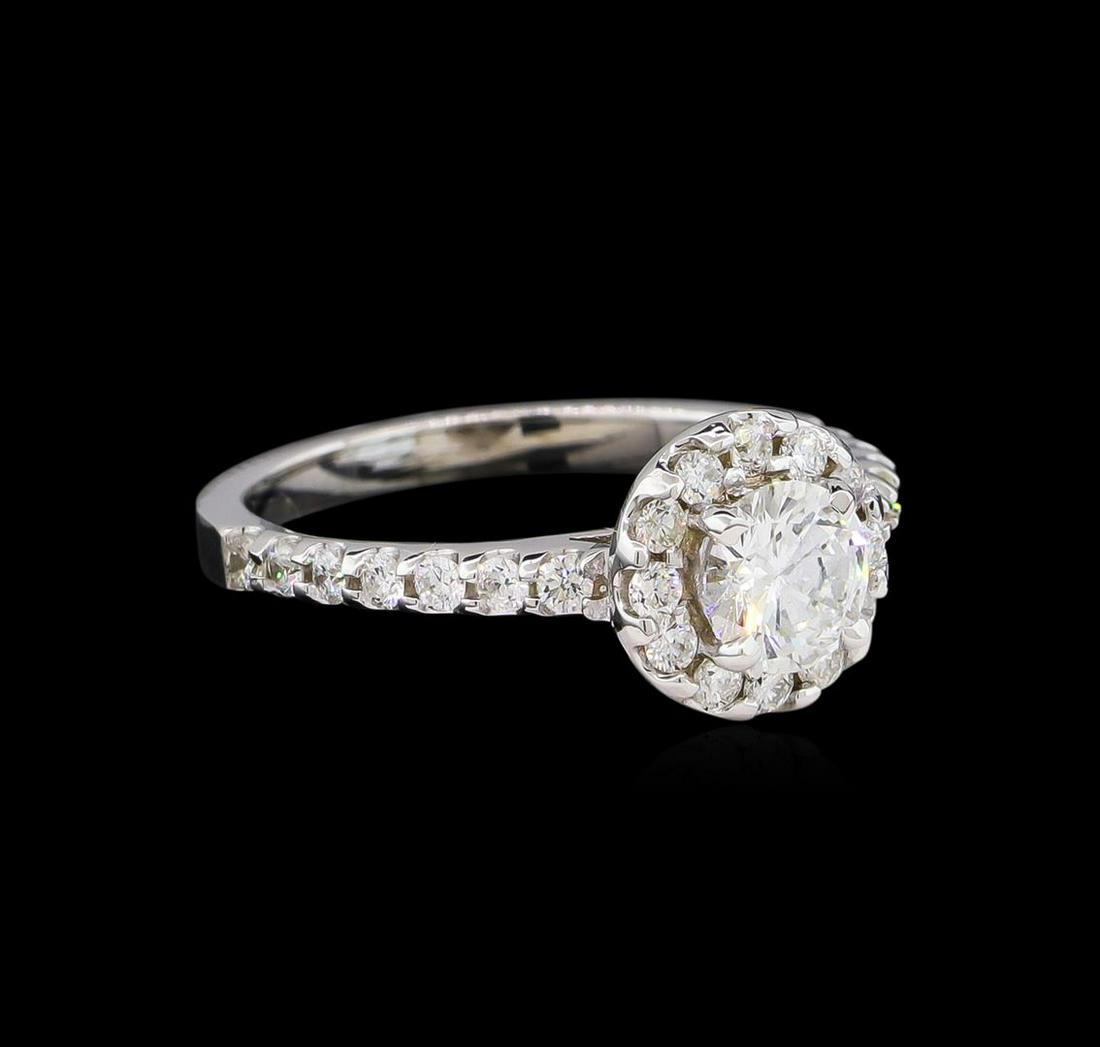 1.06 ctw Diamond Ring - 14KT White Gold: One electronically tested 14KT white gold lady's cast wedding ring with a cathedral halo with a bright polish finish. The featured lady's ring has a shank measuring 1.99 millimeters wide. Identified w