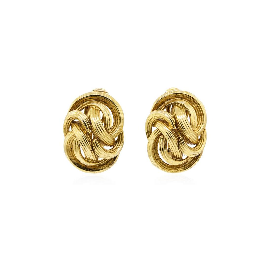 Tiffany and Company Gold Knot Earrings - 18KT Yellow: One pair of Tiffany and Company gold knot earrings featuring: 18KT yellow gold weighing 19.4 grams. The featured earrings have Omega clip backs with no posts.