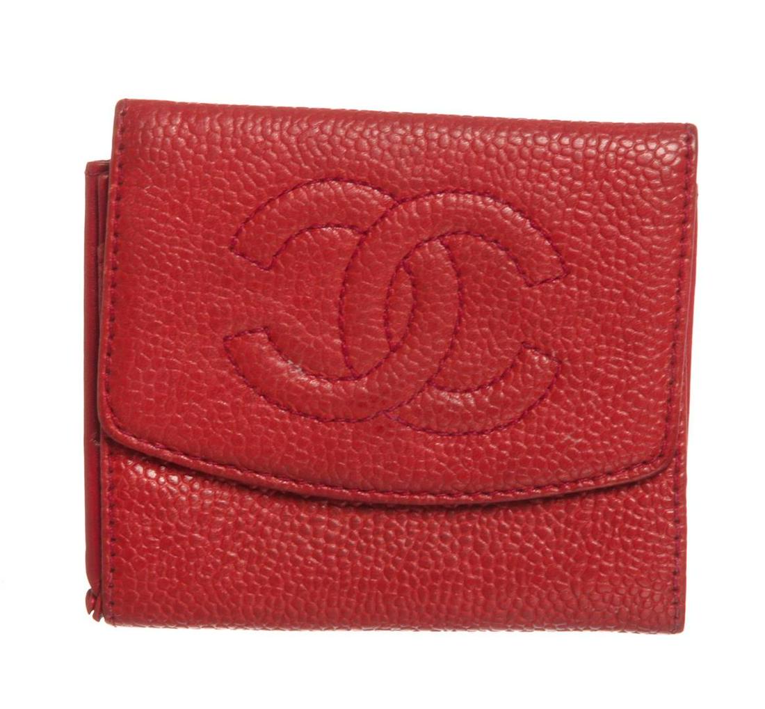 Chanel Red Caviar Leather Compact Coin Wallet: Overall CC fold-over flap snap closure. Interior is red canvas lined and contains one credit card slip pocket. Please note the inner lining has coin stains, please look at pictures. Authentic.