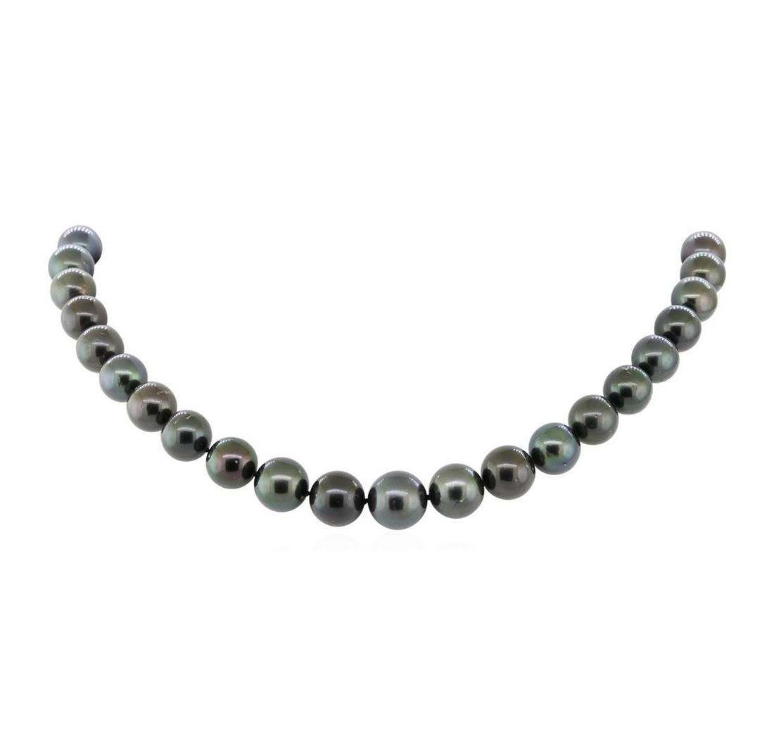 Tahitian Pearl Necklace - 14KT White Gold: One graduated, single strand cultured Tahitian pearl necklace. The strand has each pearl individually hand knotted and measures 18 inches in length. The necklace is finished with a scalloped 14KT whit