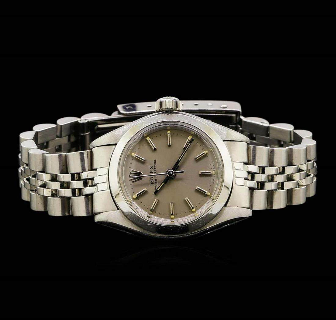 Rolex Stainless Steel Oyster Perpetual Ladies Watch: One ladies, vintage Rolex Oyster Perpetual model Stainless Steel wristwatch electronically tested, Case: 25mm oyster, Crown: twinlock with logo, Bezel: polished, Custom Crystal: acrylic lens. Movement
