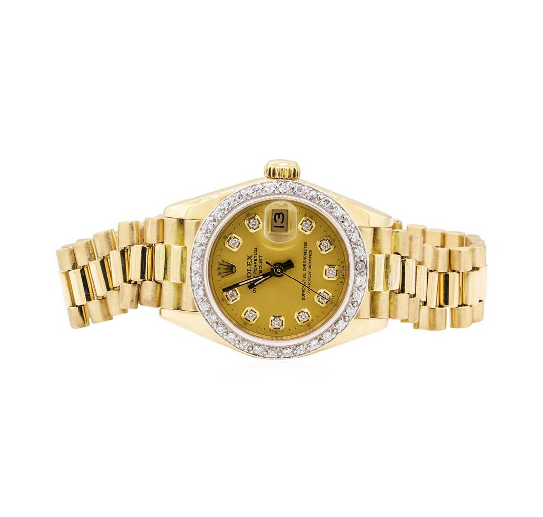 Rolex 0.40 ctw Diamond President Wristwatch - 18KT: One lady's, hand crafted and machine milled Rolex Oyster perpetual President wrist watch electronically tested 18KT yellow gold, Serial#: 8095681, Case: 26mm, Crown: screw-down, Bezel: custom diamond