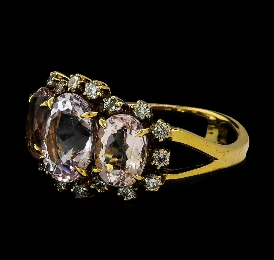 4.72 ctw Morganite and Diamond Ring - 18KT Rose Gold: One electronically tested 18KT rose gold ladies cast morganite and diamond ring. The ring features a series of three morganites set within a diamond bezel supported by split shoulders, completed by a 