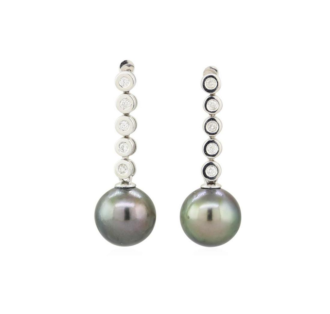 Pearl and Diamond Earrings - 14KT White Gold: One Pair electronically tested 14KT white gold, Tahitian black pearl and diamond set earrings A Tahitian cultured pearl is set at the bottom of a pair of drop style earrings. Round brilliant cut diamo