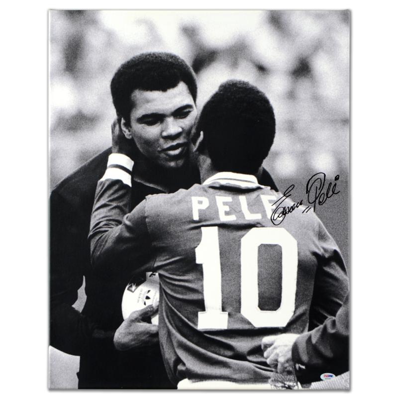 Pele & Ali Hug by Pele: "Pele & Ali Hug" is a gallery wrapped print on canvas that is autographed by legendary Brazilian footballer, Pele! This piece was authenticated by PSA/DNA, which authenticates sports memorabilia using