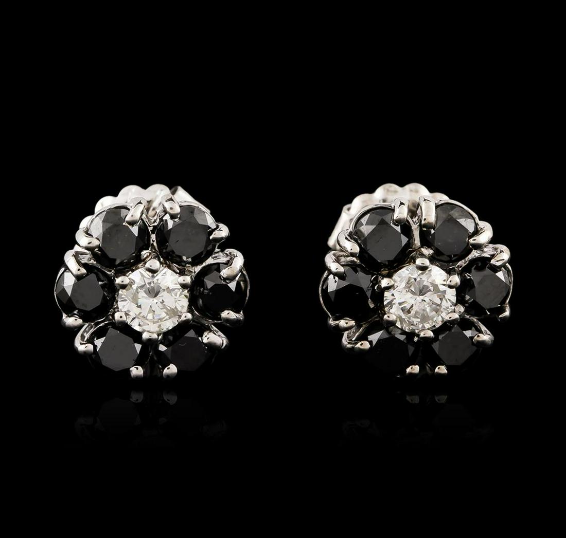 14KT White Gold 3.32 ctw Black and White Diamond: One pair electronically tested 14KT white gold ladies cast & assembled black and white diamond floret earrings with standard backs. Bright polish finish. Condition is good. Containing: Twelve prong se