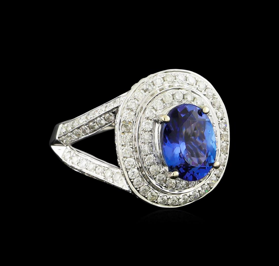 14KT White Gold 2.46 ctw Tanzanite and Diamond Ring: One electronically tested 14KT white gold ladies combination cast & assembled tanzanite and diamond ring with a split shank with a bright polish finish. Identified with markings of "14K". Condition is
