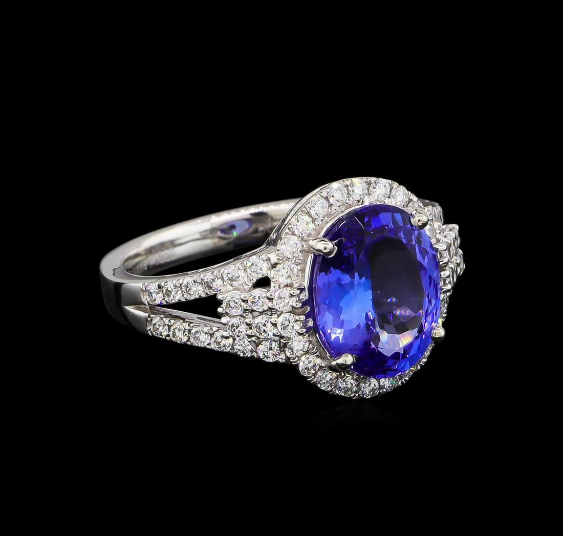 3.38 ctw Tanzanite and Diamond Ring - Platinum: One electronically tested platinum lady's cast fashion ring with a split shank halo with a bright polish finish. The featured lady's ring has a shank measuring 2.62 millimeters wide. Trademark is Oria