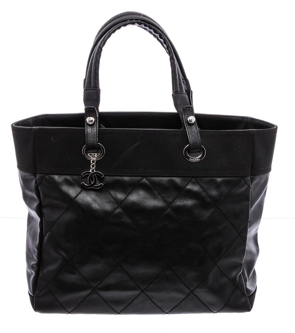 Chanel Black Quilted Coated Canvas Large Paris-Biarritz: One Chanel Black Quilted Coated Canvas Large Paris-Biarritz Tote Bag. Black quilted coated canvas Chanel Large Paris-Biarritz tote with silver-tone hardware, dual flat shoulder straps, protective feet