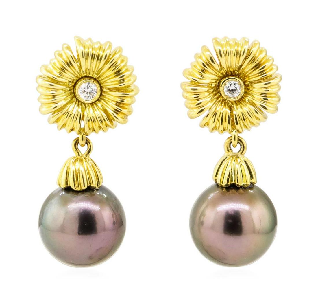 0.10 ctw Diamond and Tahitian Pearl Floral Earrings -: One pair of floral dangle earrings with a drop of 30 millimeters featuring: 18KT yellow gold weighing 13.8 grams containing two diamonds weighing 0.10ctw and two Tahitian pearls measuring 11.2 millime