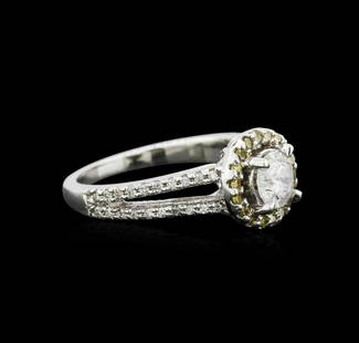 1.03 ctw Diamond Ring - 14KT White Gold: One stamped & tested 14KT white gold lady's cast wedding ring with a split shank with a bright polish finish. Condition is new. Identified with markings of "14K". Containing: One prong set round
