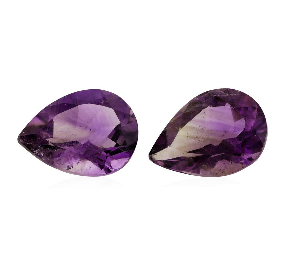 14.63 ctw. Natural Pear Cut Amethyst Parcel of Two: One natural pear cut amethyst parcel of two with an exact weight of 14.63ctw., clarity is slightly to moderately included, purple to v.s. brownish purple, medium light. Gemological Appraisals Services