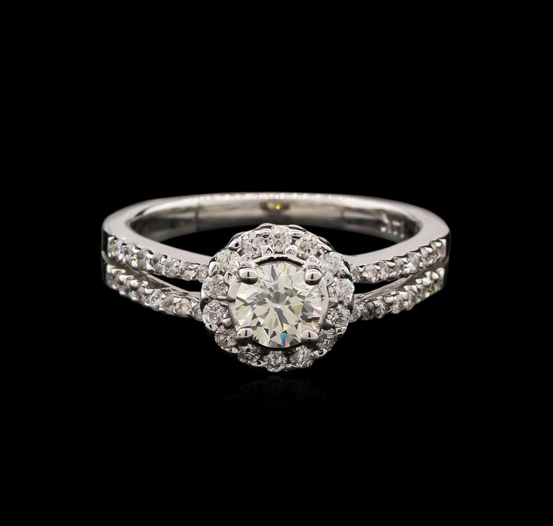 0.84 ctw Diamond Ring - 14KT White Gold: One electronically tested 14KT white gold lady's cast wedding ring with a split shank with a bright polish finish. The featured lady's ring has a shank measuring 2.15 millimeters wide. Identified with