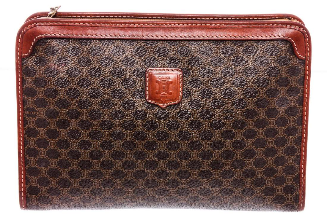 Celine Vintage Monogram Brown Coated Canvas Leather: One Celine Vintage Monogram Brown Coated Canvas Leather Pouch Bag. Brown monogram coated canvas leather Celine vintage pouch with gold-tone hardware, brown leather trim, tan leather lining, one zipper