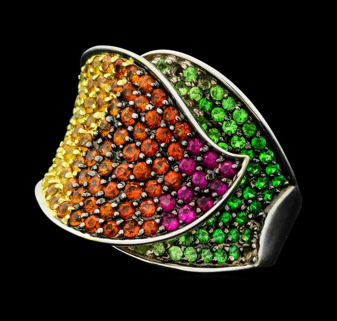 18KT White Gold 3.68 ctw Multi-colored Sapphire and: One electronically tested 18KT white gold lady's cast fashion floral design ring with a tapered shank with a bright polish finish. The featured lady's ring has a shank measuring 4.90 millimeters wide.
