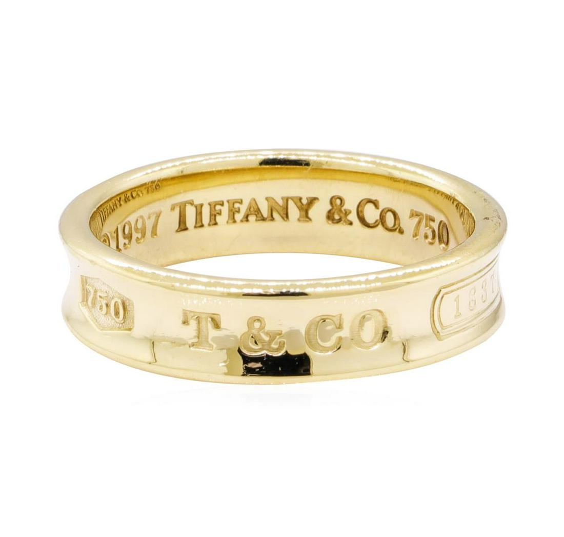 Tiffany and Company "1837" Ring - 18KT Yellow Gold: One Tiffany and Company "1837" ring featuring: 18KT yellow gold weighing 10.3 grams. The ring has a shank measuring 6.00 millimeters wide.