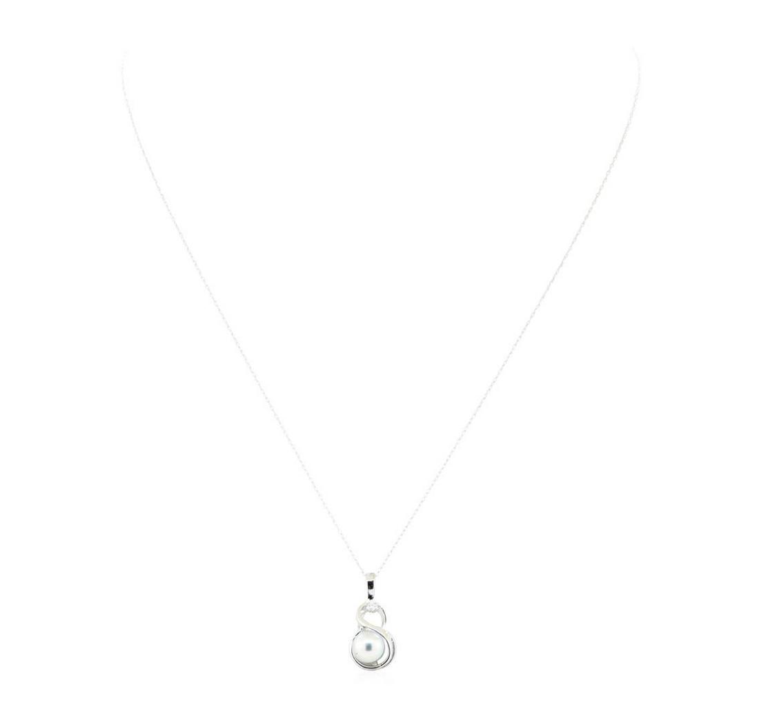 0.03 ctw Diamond and Silver Pearl Infinity Motif: One infinity motif pendant with an attached eighteen inch long fine rope chain featuring: 10KT white gold weighing 2.3 grams containing one silver colored pearl and diamonds weighing 0.03ctw.