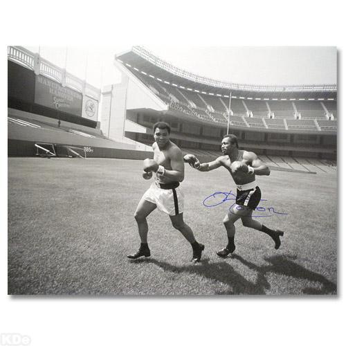 Ken Norton and Ali, Yankee Stadium 2005 by Norton & Ali: Perfect for any boxing enthusiast, "Ken Norton and Ali, Yankee Stadium" commemorates the world-famous boxing matches between Ken Norton and Muhammad Ali. This photograph is hand-autographed by multi-t