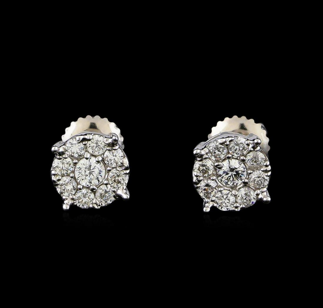 0.71 ctw Diamond Earrings - 14KT White Gold: One pair electronically tested 14KT white gold cast & assembled diamond earrings with screw backs. Each earring features an organized diamond cluster and supported by a lattice under gallery. Bright p