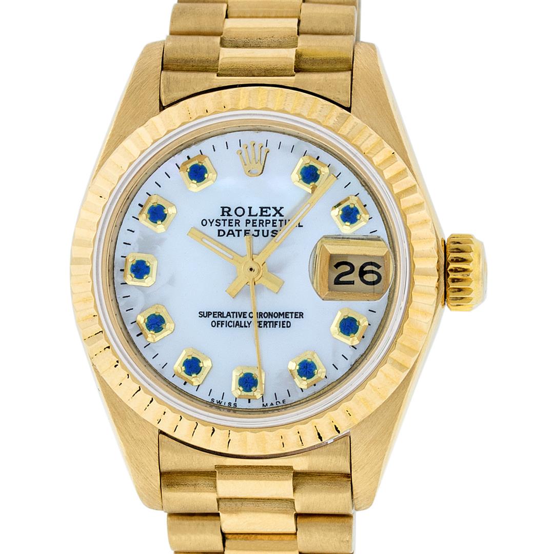 Rolex Ladies 18K Yellow Gold Mother Of Pearl Sapphire: One Ladies Rolex 18K Yellow Gold President Polished, Serviced & Electronically Tested, 18K Yellow Gold Case: 26mm, 18K Yellow Gold Crown, Bezel: 18K Yellow Gold Fluted Bezel. Custom Crystal: New Acryl